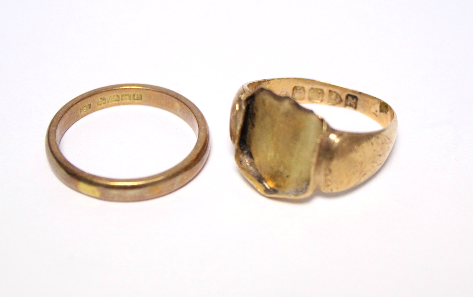 An 18ct. gold wedding band; & an 18ct. signet ring – the hardstone matrix missing. (6.8gm total).