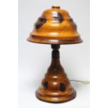 An early 20th century Palm-wood table lamp with domed shade, on turned flared base; 19” high.