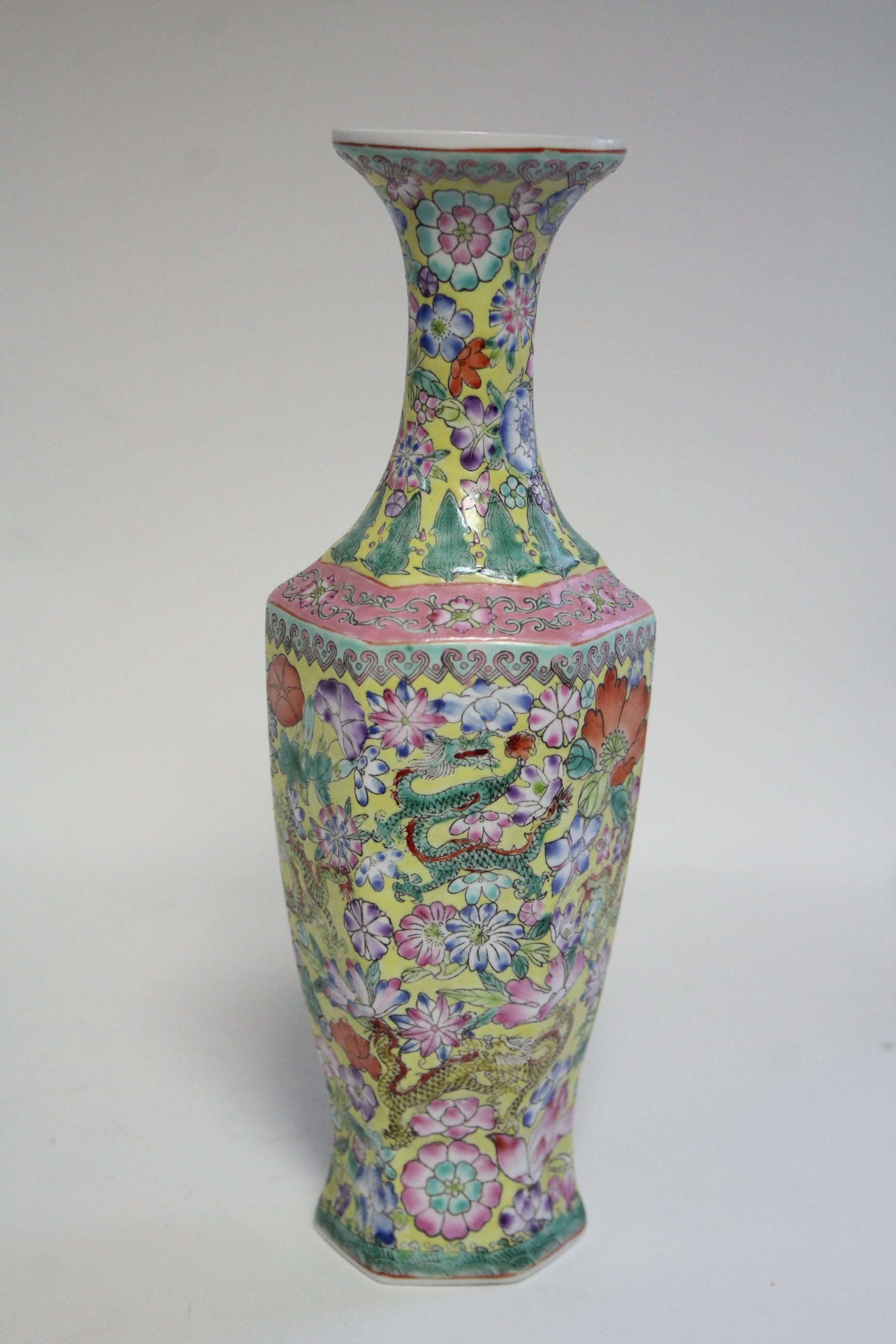 A 20th century Chinese yellow-ground eggshell porcelain slender hexagonal baluster vase with all- - Image 4 of 7