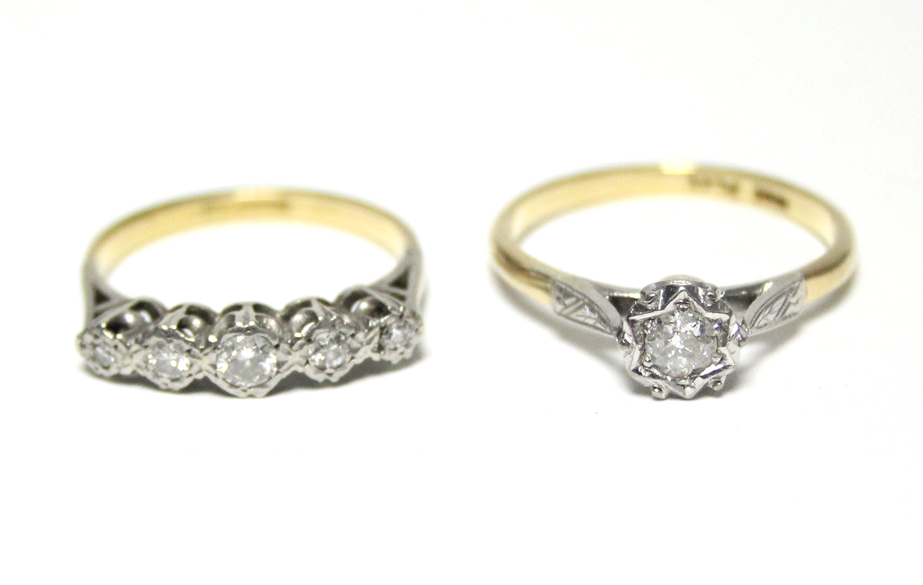 An 18ct. gold & platinum ring set five small graduated diamonds; & a similar ring set single