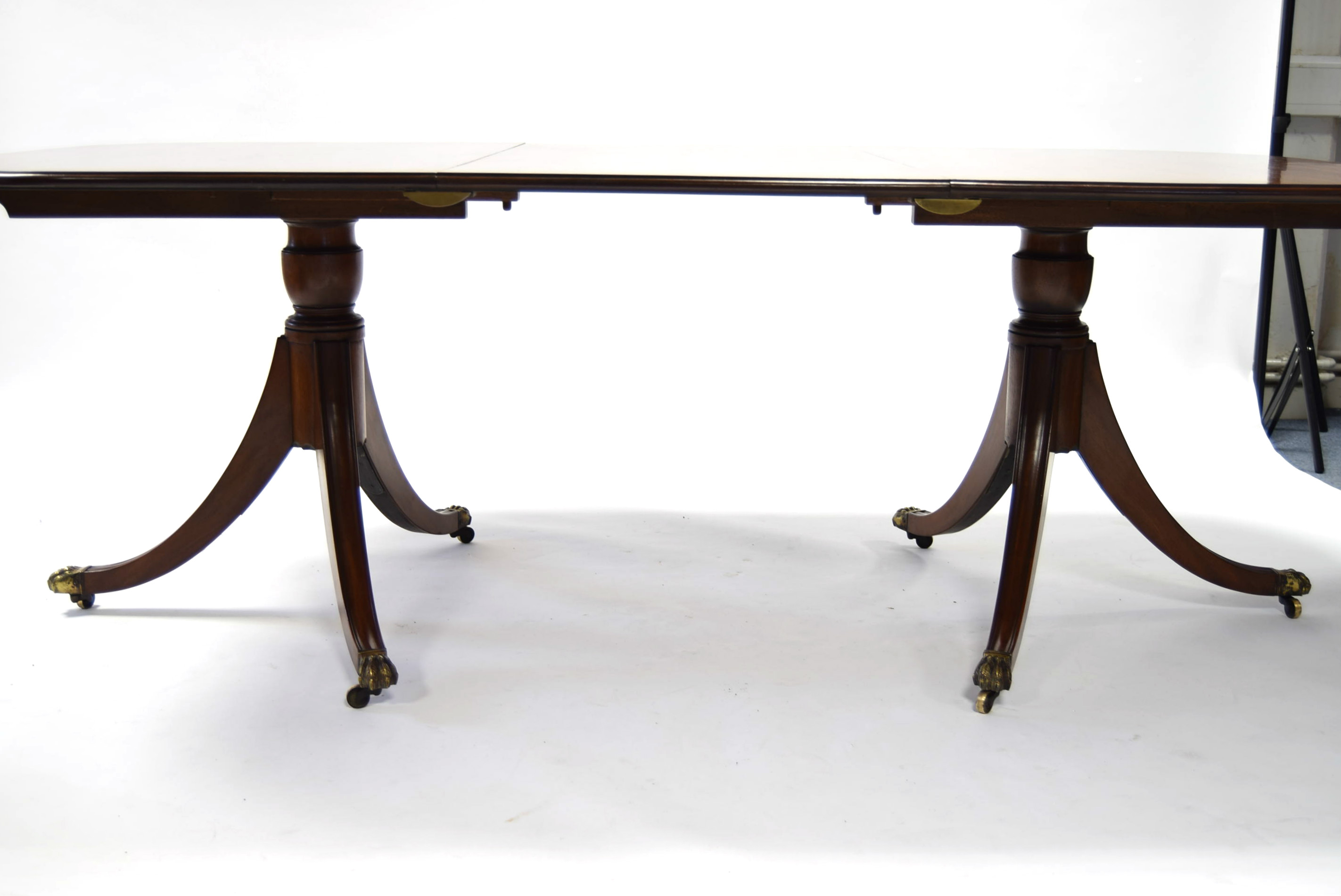 A Regency-style mahogany twin-pedestal dining table, the rectangular top with rounded corners, one - Image 3 of 3