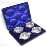 A set of four Quaich-shaped sweetmeat dishes with pierced decoration to the sides & the flat