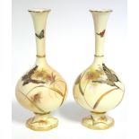 A pair of Grainger’s Worcester bottle vases of blush ivory ground, with coloured & raised gilt