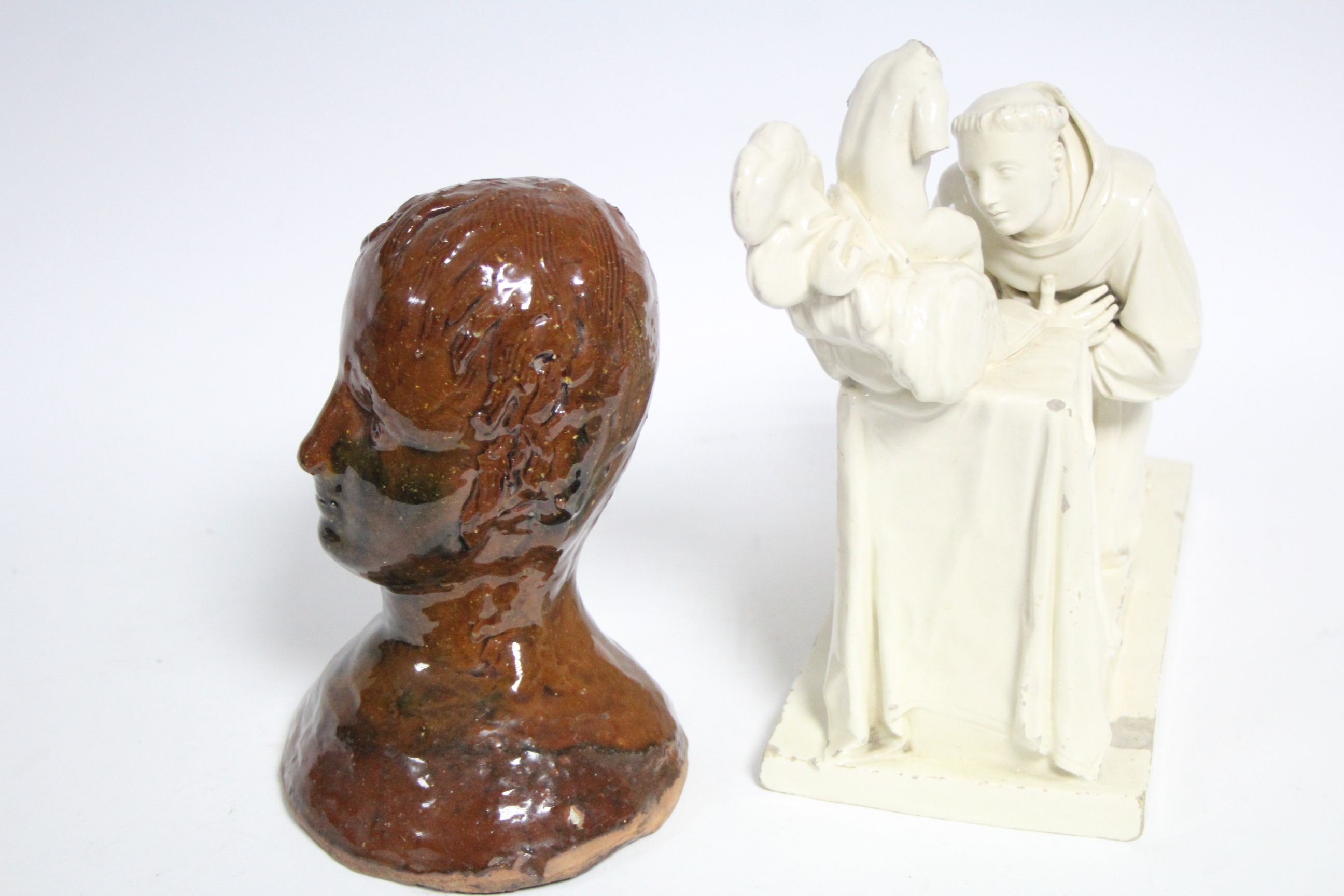 A naïve brown glazed & green splashed terracotta figural bust, 7” high; & a creamware group of a - Image 2 of 5