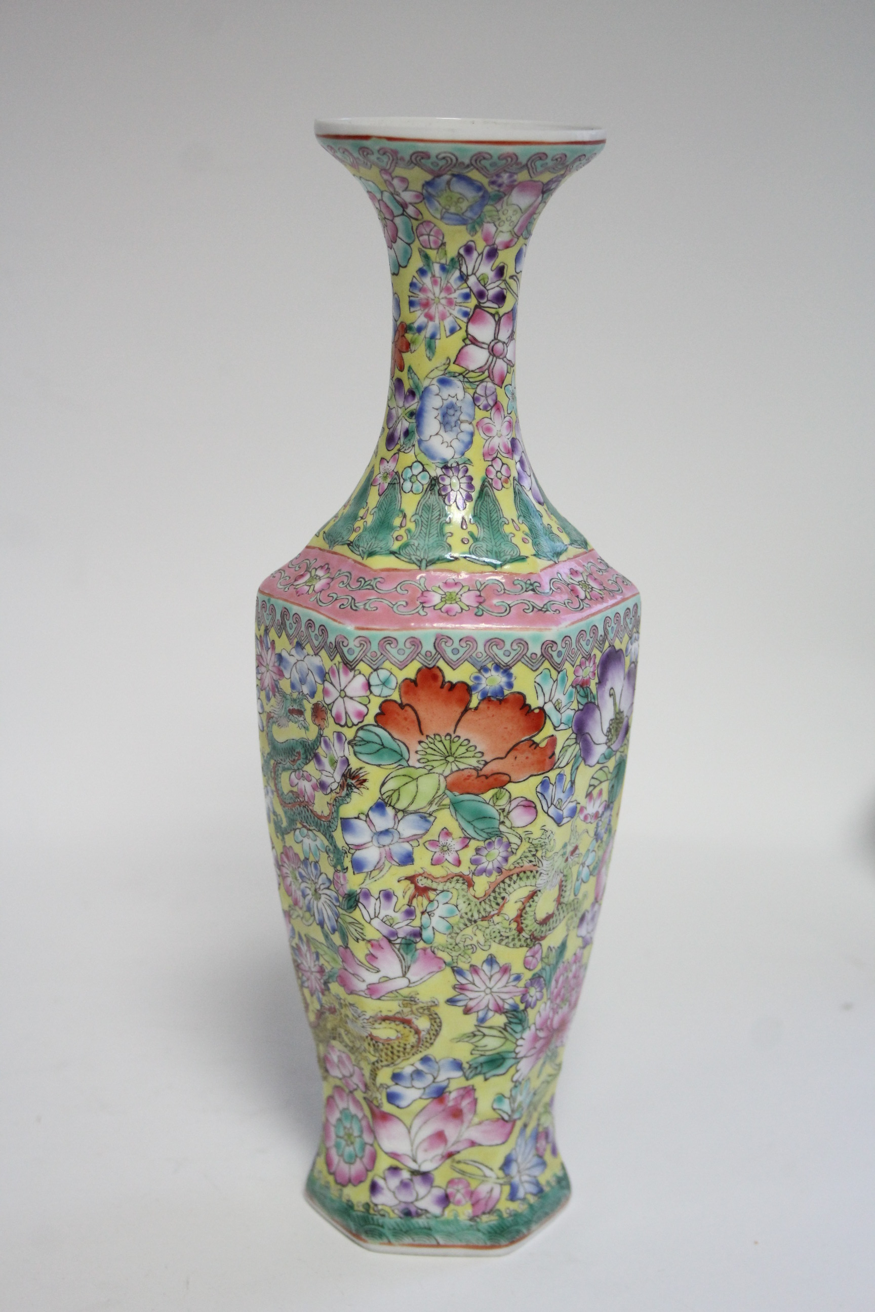 A 20th century Chinese yellow-ground eggshell porcelain slender hexagonal baluster vase with all- - Image 5 of 7