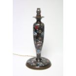 A cloisonné enamel table lamp of slender ovoid form with all-over floral decoration on a black