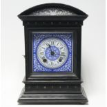 A late 19th century striking mantel clock with blue & white ceramic square dial, in ebonised dome-