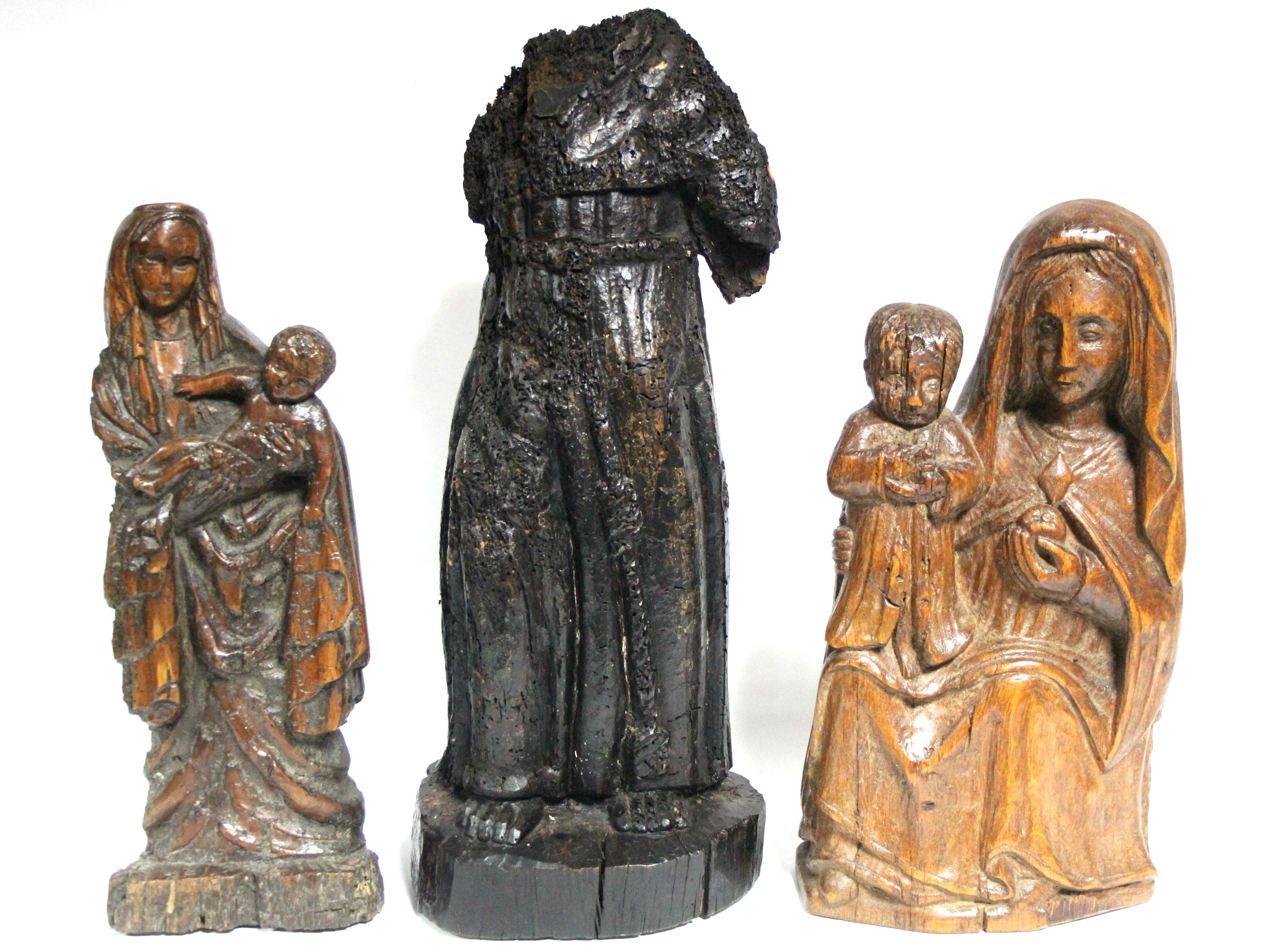 An early carved wood standing robed figure with traces of painted decoration, 18½” high (lacking