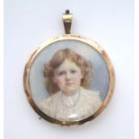 An early 20th century portrait miniature of a young girl, signed S. A. Elford; 1½” diam., in 9ct.