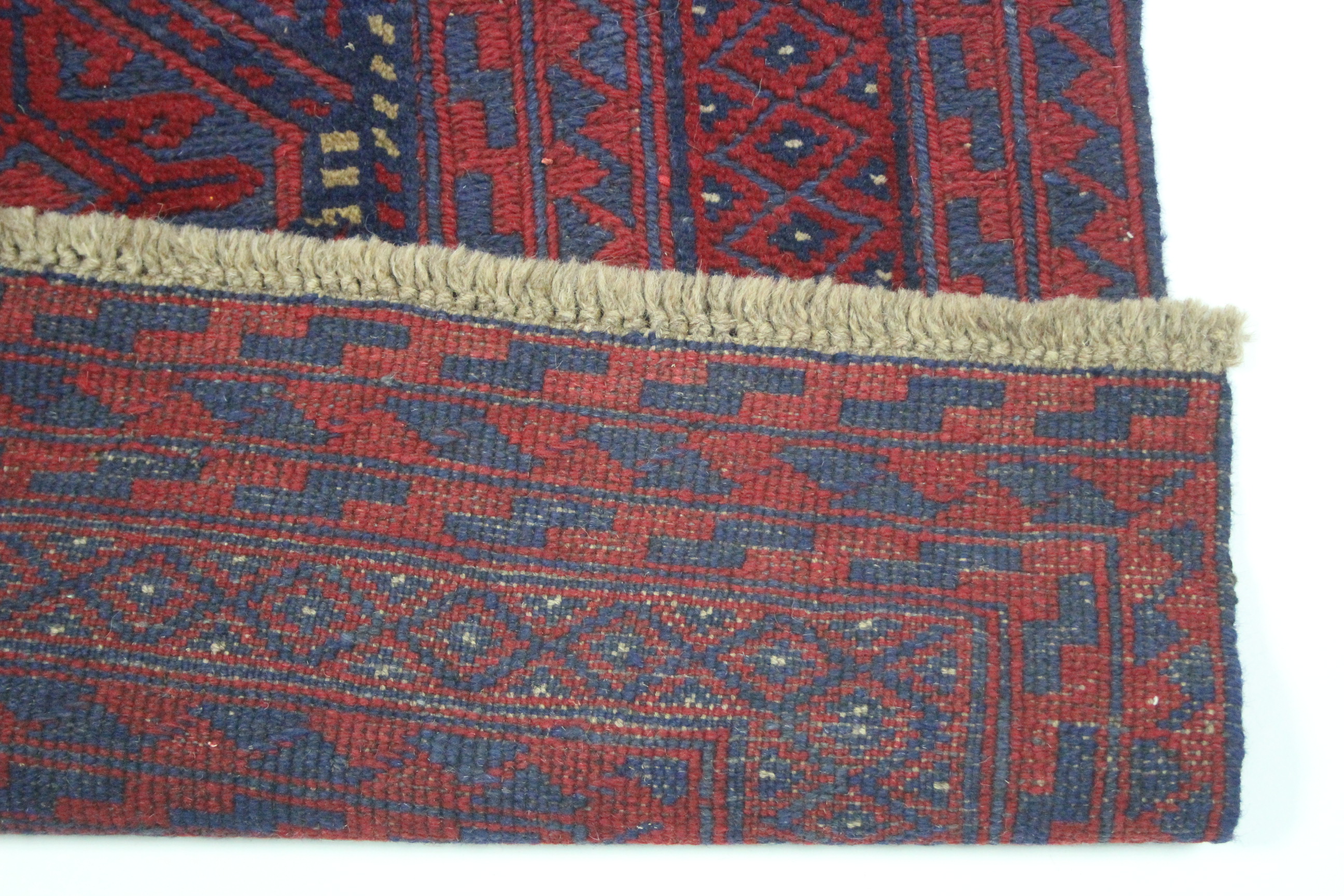 A Kazak rug of crimson, deep blue & ivory ground with geometric lozenge design within multiple - Image 2 of 2