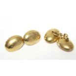 A pair of 18ct. gold hollow oval cuff-links. (7.6gm).