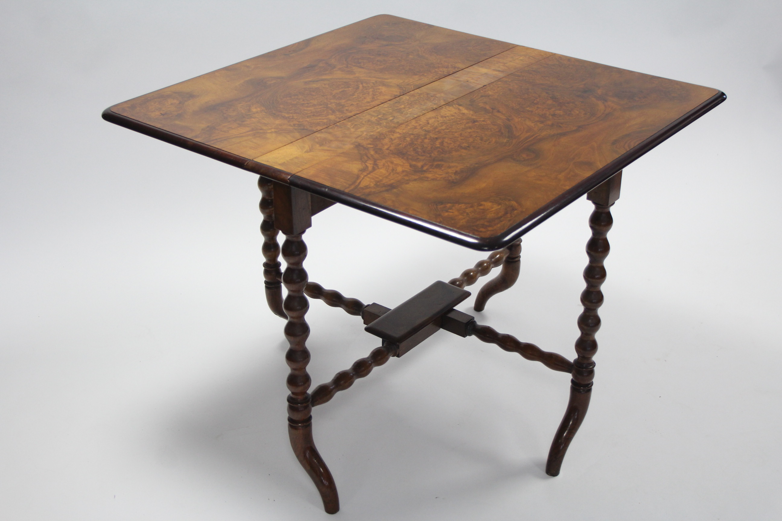 A Victorian burr-walnut Sutherland table on bobbin-turned supports with curved legs; 36” wide. - Image 3 of 4