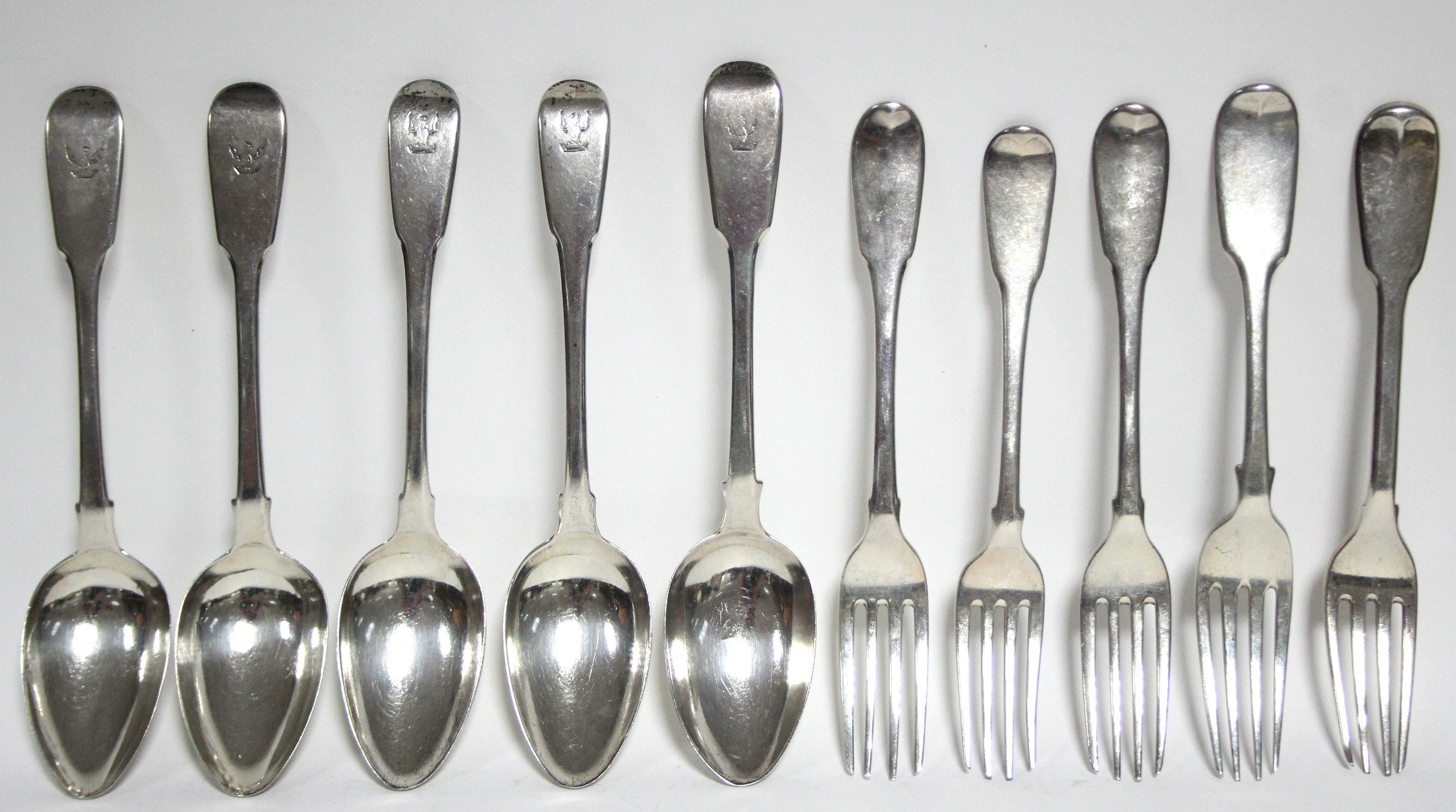 Five George III & George IV Fiddle pattern dessert spoons; & five similar dessert forks; odd dates &