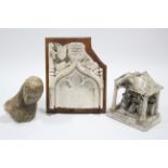 A plaster fragmentary bust of the Madonna, 11”; a carved plaster gothic arch, 15” high; & a