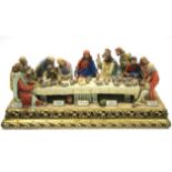 A Capo-di-Monte large porcelain group of The Last Supper, signed to reverse “Cortese”, on