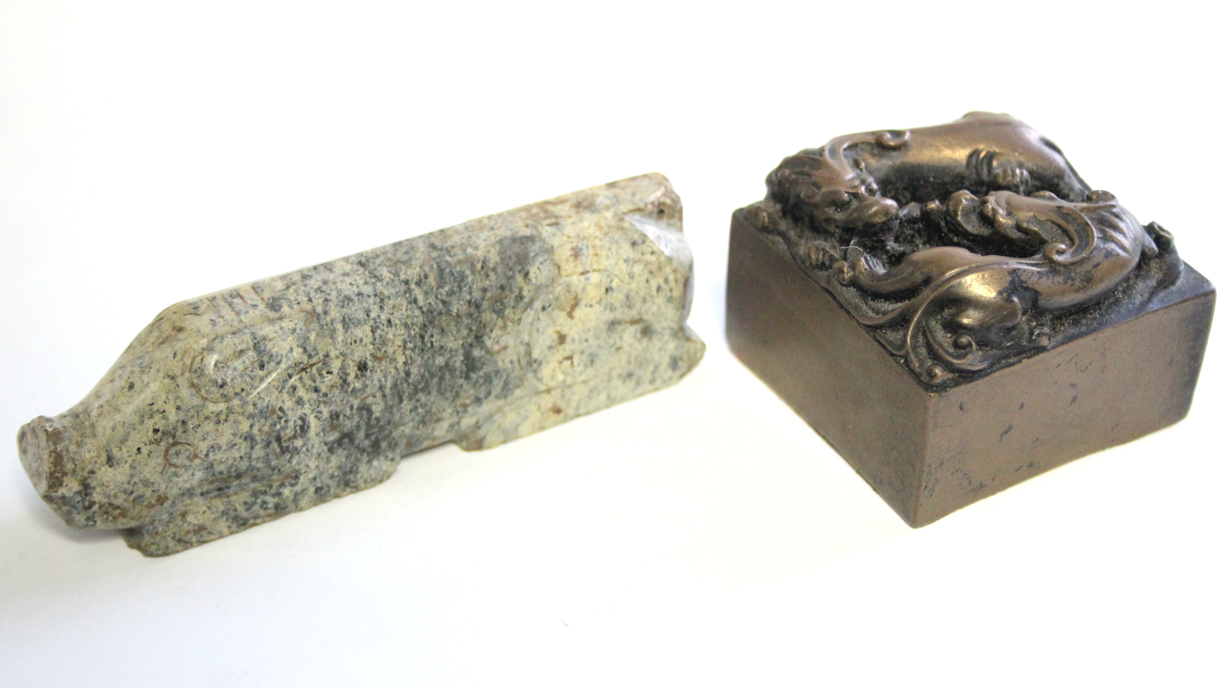 A Chinese carved opaque green/white jade stylised model of a pig, 3¾” long; & a bronzed square