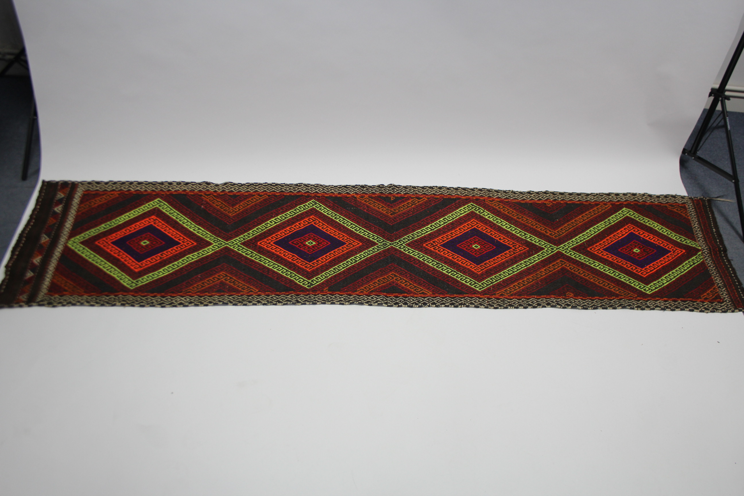 A Suzni Kelim runner of bright multi-coloured geometric design, with row of four lozenges within - Image 3 of 3
