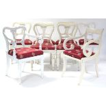 A matched set of eight early Victorian dining chairs with padded drop-in seats upholstered crimson