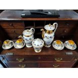 A 19th century porcelain thirteen piece part coffee service of white ground & with blue & gold