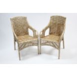 A pair of Ikea “Majby” wicker conservatory chairs.