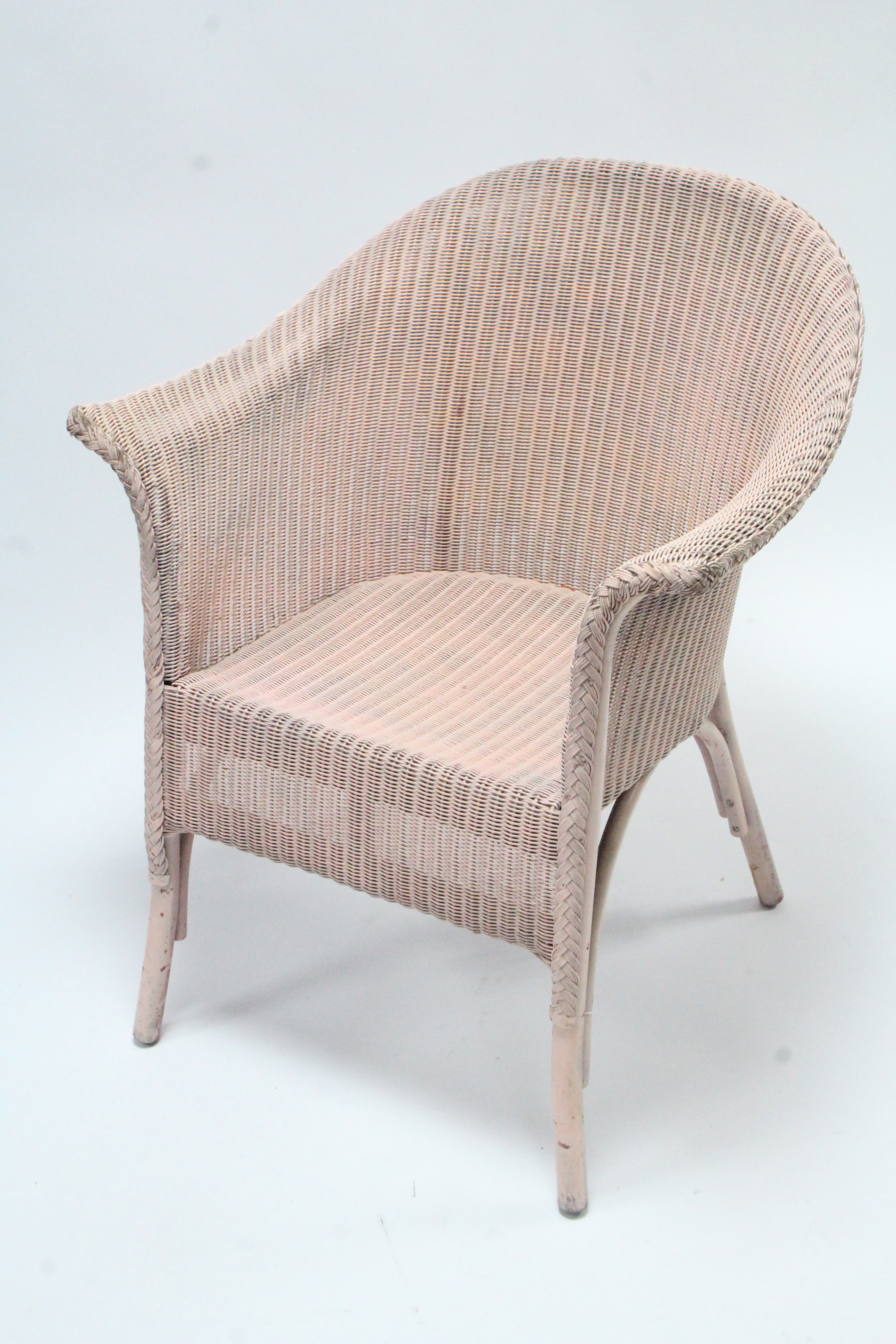 A 1940’s pink painted Lloyd Loom chair.