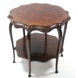 A late Victorian inlaid mahogany occasional table, the shaped circular top with pie-crust edge, on