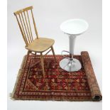 An Ercol spindle-back kitchen chair with hard seat, & on round tapered legs with spindle stretchers;