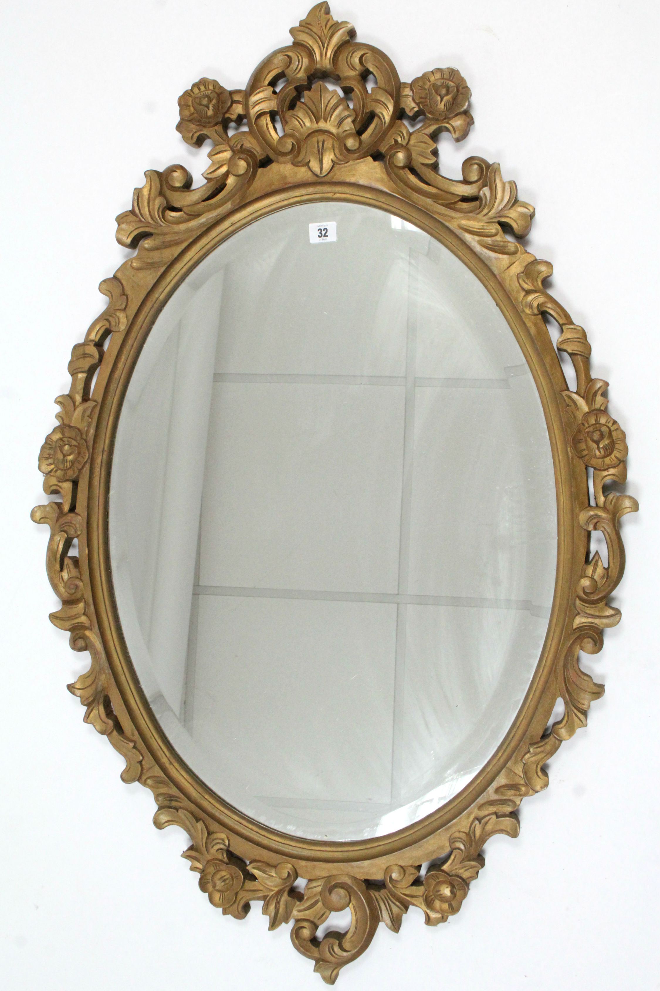 A 19th century-style large gold painted & carved wood frame oval wall mirror inset bevelled plate,