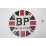 A reproduction painted cast-iron sign “BP MOTOR SPIRIT” 9¾” diam.