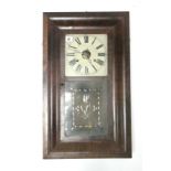 A late 19th century American wall clock by Chauncey Jerome of New Haven enclosed by decorative