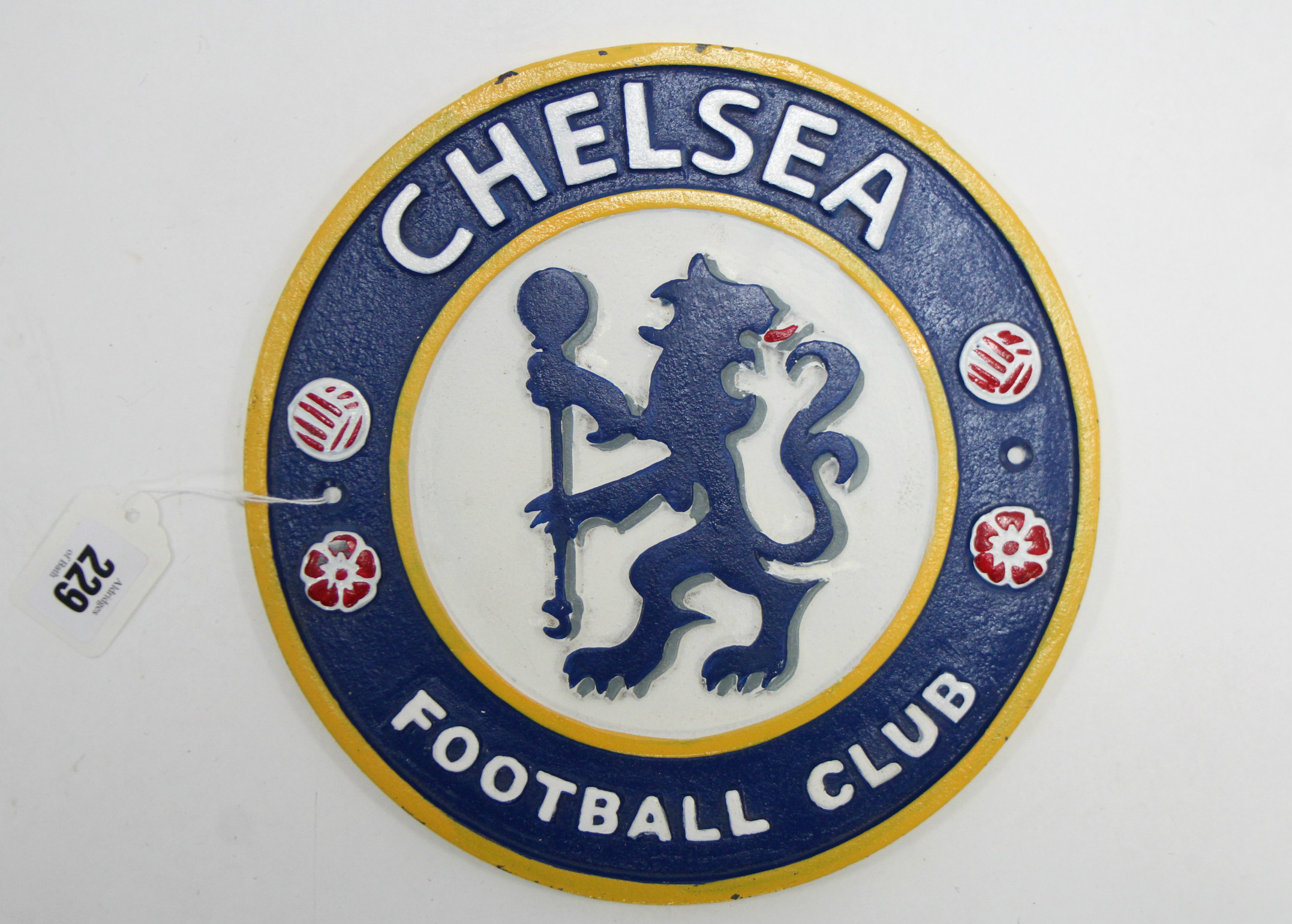 A modern painted cast-iron plaque “CHELSEA FOOTBALL CLUB”, 9½” diam.