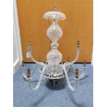 A heavy cut-glass chandelier with bulbous centre column & with nine scroll arms, 24” high.