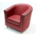 A Mark’s & Spencer’s Crimson leather tub-shaped chair.