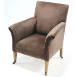 An Edwardian square-back easy chair upholstered brown velour, & on mahogany short square tapered