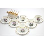 A set of six Royal Worcester floral decorated coffee cans & saucers; & a “Foxhound” pottery four-