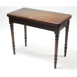 A 19th century mahogany card table inset crimson baize to the rectangular fold-over top, & on turned