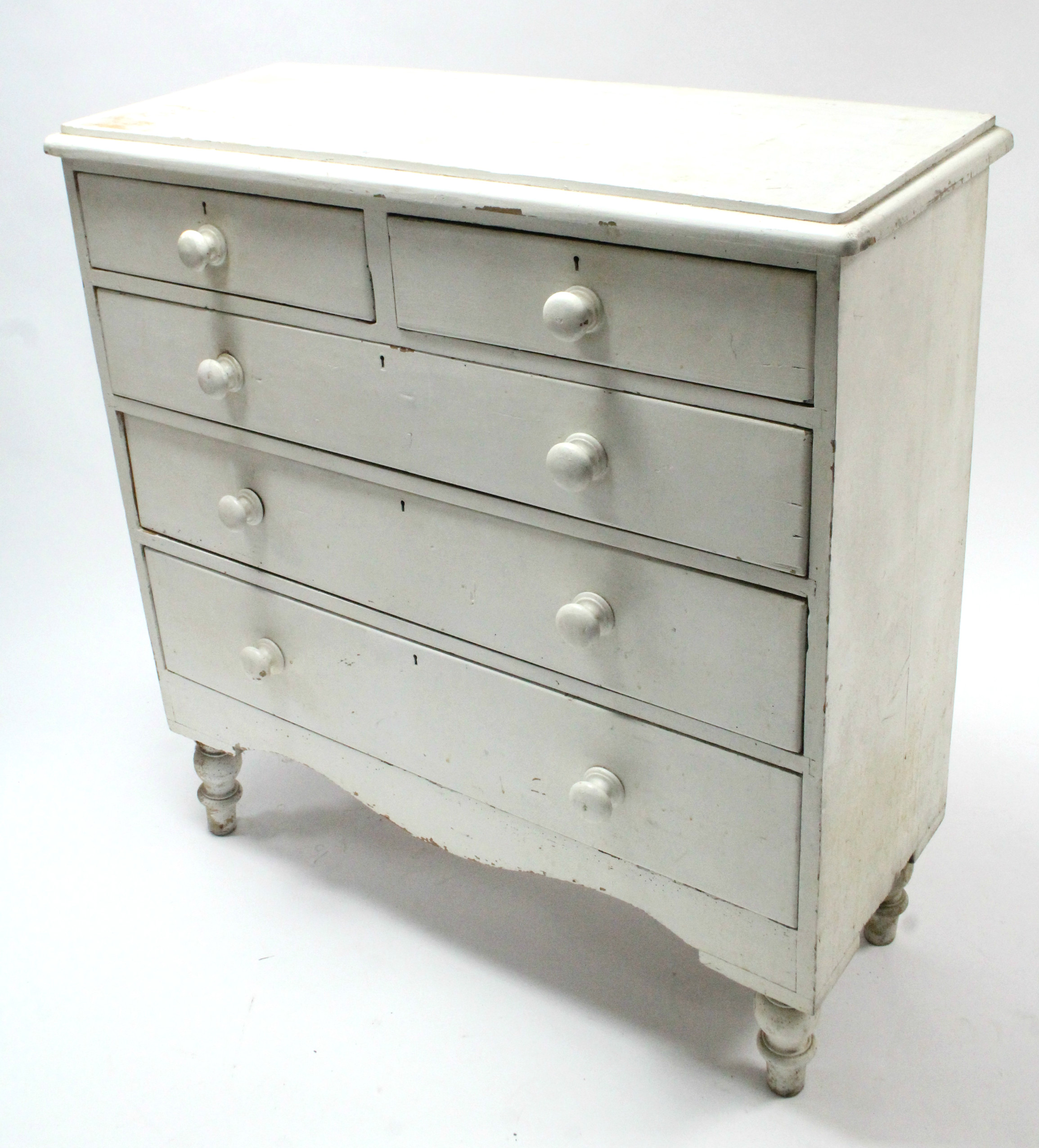 A Victorian white painted pine chest fitted two short & three long graduated drawers with turned