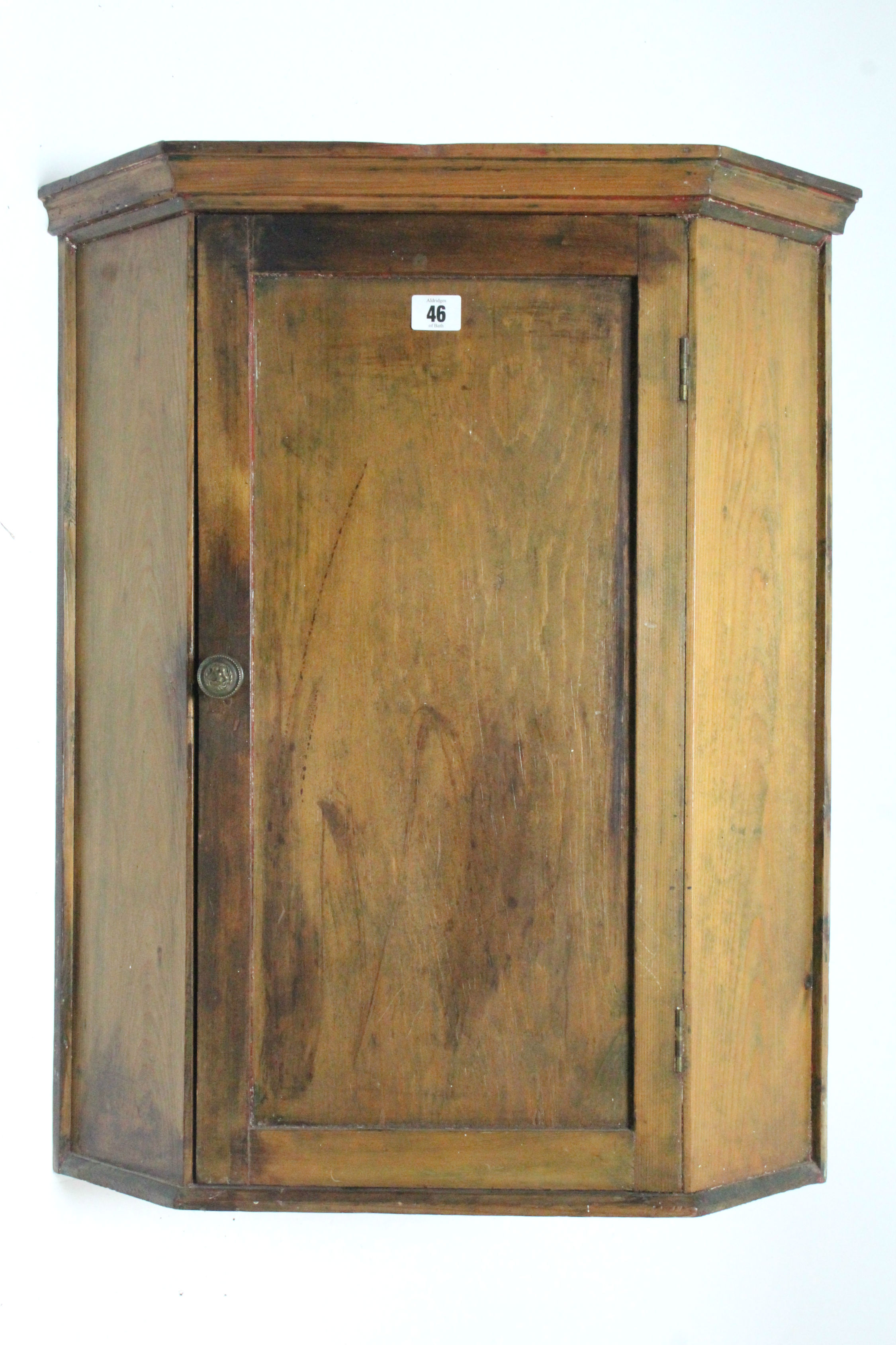 A pine small hanging corner cupboard fitted two shelves enclose by panel door, 21¾” wide x 26”