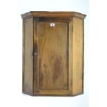 A pine small hanging corner cupboard fitted two shelves enclose by panel door, 21¾” wide x 26”