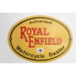 A reproduction painted cast-iron sign “Authorized ROYAL ENFIELD Motorcycle Dealer”, 12” x 9”.