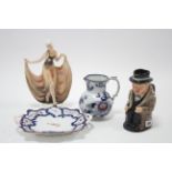 A Royal Doulton toby jug “Winston Churchill”; a ceramic female figure; a floral decorated jug; & a