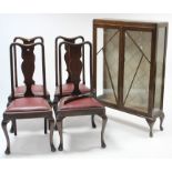 An oak china cabinet (lacking shelves) enclosed by pair of glazed doors with glazed sides & on short