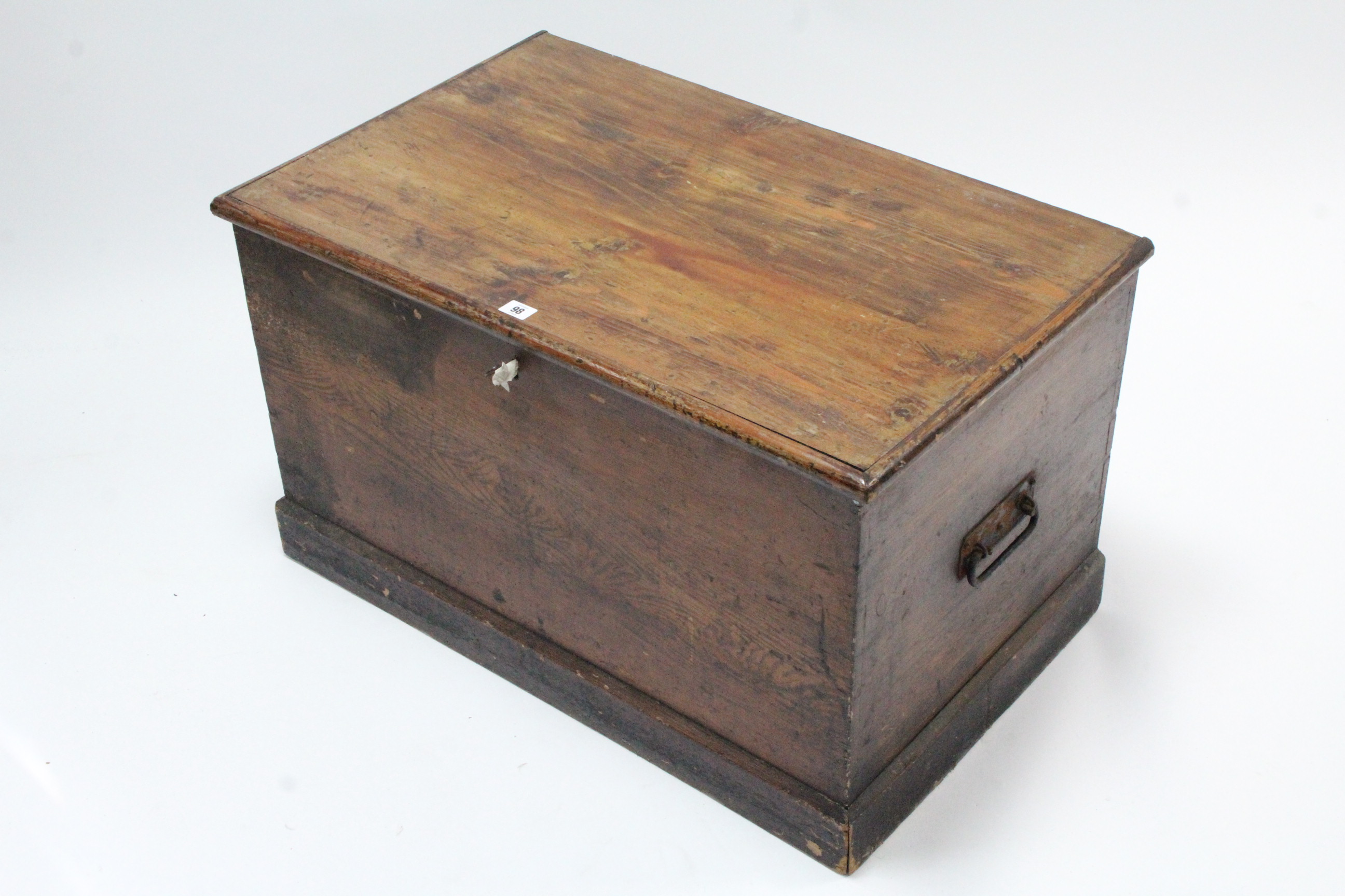 A Victorian grained pine blanket box with hinged lift-lid, with wrought-iron side handles & on