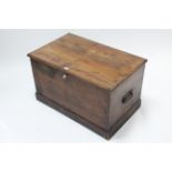 A Victorian grained pine blanket box with hinged lift-lid, with wrought-iron side handles & on