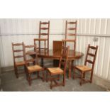 A set of six hardwood ladder-back dining chairs with woven rush seats, & on baluster-turned legs