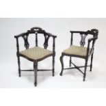 A pair of 19th century splat-back corner elbow chairs with padded seats, & on turned legs with