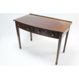 A late 19th/early 20th century inlaid-mahogany break-front dressing table fitted two frieze drawers,