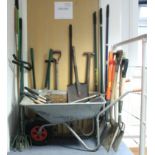 A Chillington aluminium wheelbarrow; and various gardening tools.