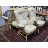 An Ercol light elm-frame four-piece lounge suite comprising a two-seater settee 57” long, a pair