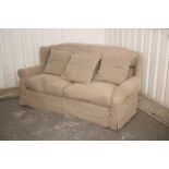A modern three-seater settee with loose cushions to the seat & back with Tetrad brown loose